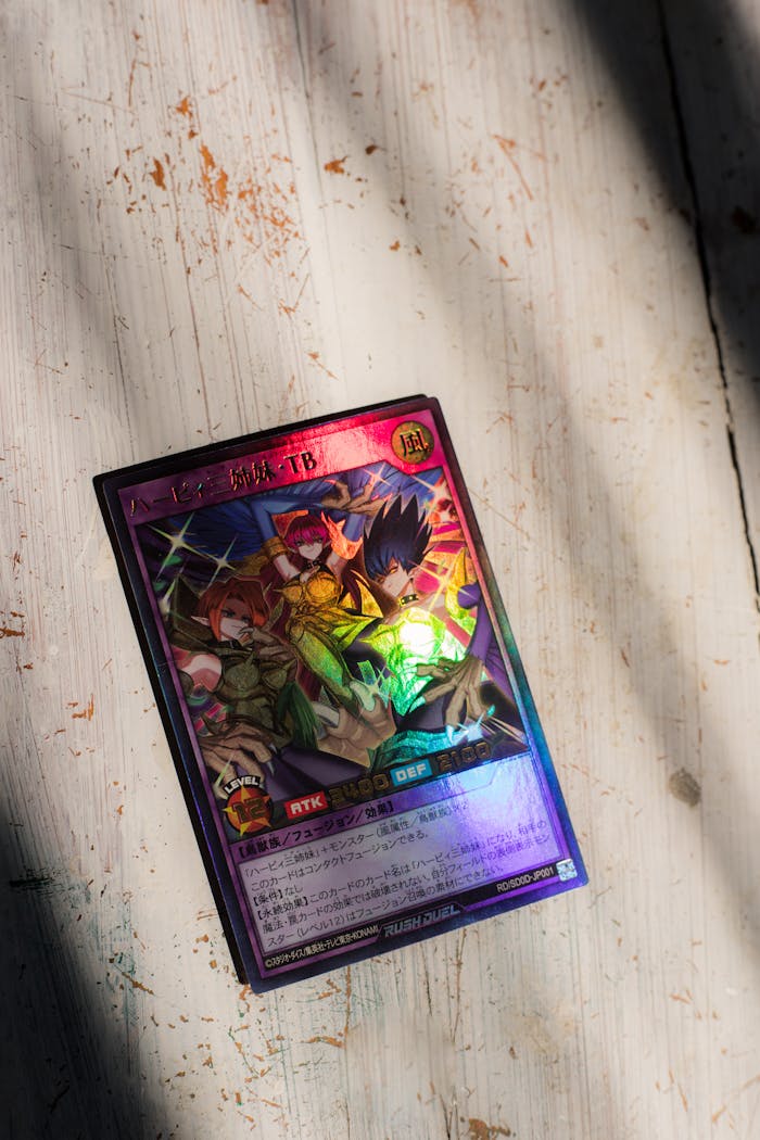 gallery-4 A vibrant Yu-Gi-Oh trading card with a holographic prismatic finish on a rustic surface.